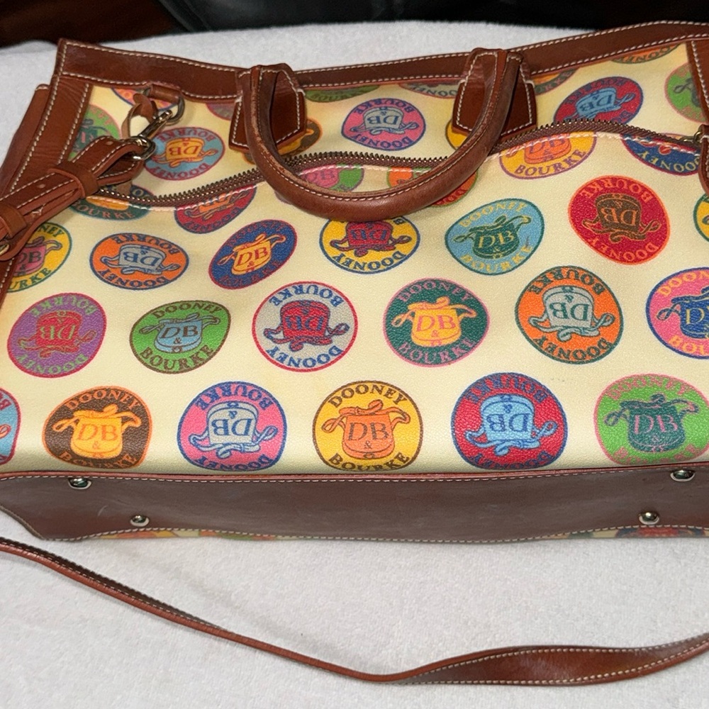 Gently used leather & coated canvas Dooney & Bourke large, domed pocket zip tote
